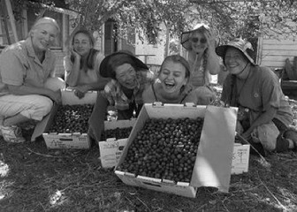 The Grateful Gleaners share a moment at Golden Rule Garden - photo by Ree Slocum